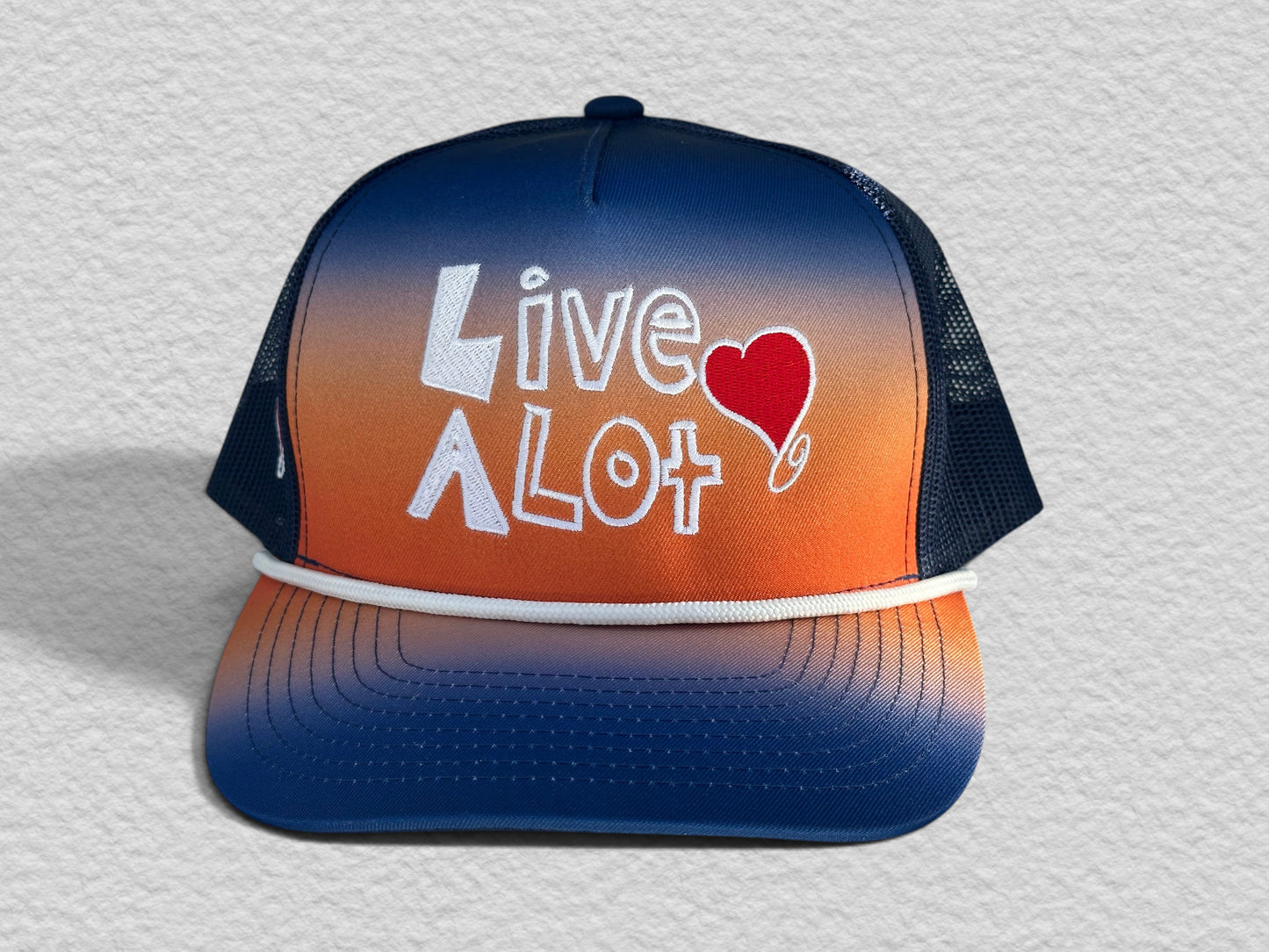 LIVE A LOT — Sunset Fade Rope Trucker Hat