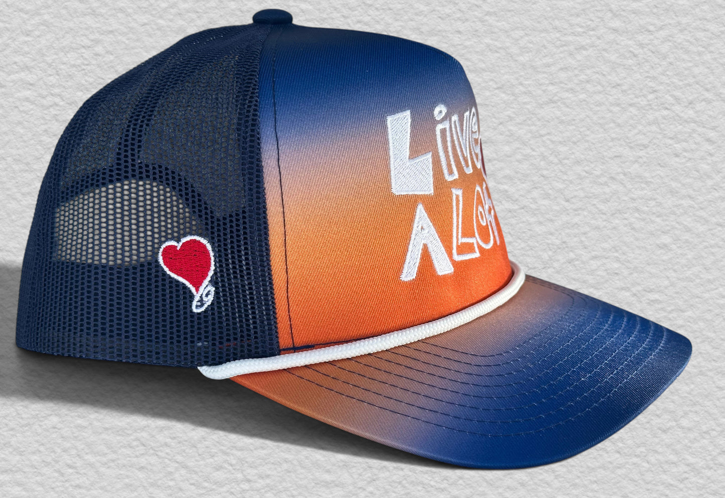 LIVE A LOT — Sunset Fade Rope Trucker Hat